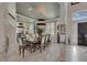 Formal dining room with a large table, modern chandelier, and access to the entryway at 174 Yellow Snapdragon Dr, Davenport, FL 33837
