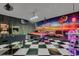 Basement game room with retro diner theming and foosball table at 174 Yellow Snapdragon Dr, Davenport, FL 33837