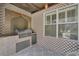 Outdoor kitchen with stainless steel grill and decorative backsplash at 174 Yellow Snapdragon Dr, Davenport, FL 33837