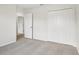 This serene bedroom has neutral paint, neutral carpet, a closet, and a view out the window at 1893 Rafton Rd, Apopka, FL 32703