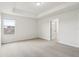 Comfortable carpeted bedroom with tray ceiling and natural light at 1893 Rafton Rd, Apopka, FL 32703