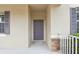 Close-up of the front door, showcasing its design and the stone accents on the porch at 1893 Rafton Rd, Apopka, FL 32703