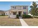 Charming two-story home with a covered front porch and well-maintained landscaping at 1893 Rafton Rd, Apopka, FL 32703