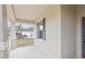 Covered front porch with white railing, offering a welcoming entry to the home at 1893 Rafton Rd, Apopka, FL 32703