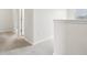Neutral hallway showcasing modern architectural features connecting the living spaces on the upper level at 1893 Rafton Rd, Apopka, FL 32703