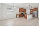 Well-lit kitchen and dining area with stainless steel appliances, granite countertops, and ample cabinet space at 1893 Rafton Rd, Apopka, FL 32703
