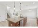 Spacious kitchen island with granite countertops and stainless steel appliances in an open-concept living space at 1893 Rafton Rd, Apopka, FL 32703