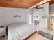 Bright bedroom featuring wood ceilings, neutral paint, and decorative accents at 200 Maitland Ave # 228, Altamonte Springs, FL 32701