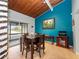Cozy dining area featuring wooden table and chairs under a ceiling with painted accent wall at 200 Maitland Ave # 228, Altamonte Springs, FL 32701