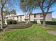 Condo exterior view featuring lush greenery and mature trees in a well-maintained community at 200 Maitland Ave # 228, Altamonte Springs, FL 32701