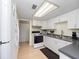 Functional kitchen with white appliances, cabinets, and practical layout for easy meal preparation at 200 Maitland Ave # 228, Altamonte Springs, FL 32701