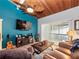 Inviting living room featuring a wooden ceiling, entertainment area, and comfortable seating at 200 Maitland Ave # 228, Altamonte Springs, FL 32701