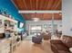 Inviting living room featuring wood ceiling, ample seating, and entertainment area with a TV at 200 Maitland Ave # 228, Altamonte Springs, FL 32701