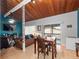 Bright living room featuring wood ceilings, a dining area, and sliding doors to the outdoor balcony at 200 Maitland Ave # 228, Altamonte Springs, FL 32701