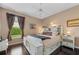 Cozy bedroom featuring a king bed, hardwood floors, and a window at 2008 Water Key Dr, Windermere, FL 34786