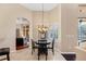 Bright breakfast nook featuring a modern chandelier and views of the pool at 2008 Water Key Dr, Windermere, FL 34786