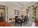 Formal dining room featuring chair rail, tray ceiling, dark wood table and chairs at 2008 Water Key Dr, Windermere, FL 34786