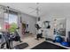 Well-lit exercise room with mirrored walls, modern exercise equipment, and fan at 2008 Water Key Dr, Windermere, FL 34786