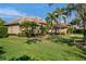 Charming single-Gathering home features mature landscaping, a tile roof, and impeccable curb appeal at 2008 Water Key Dr, Windermere, FL 34786