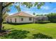 Beautiful single-Gathering home boasts a tile roof, screened lanai, and well-maintained landscaping at 2008 Water Key Dr, Windermere, FL 34786