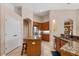Spacious kitchen featuring breakfast bar, stainless steel refrigerator, and tile floors at 2008 Water Key Dr, Windermere, FL 34786