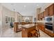 Open kitchen featuring large island with seating, stainless appliances, and lots of natural light at 2008 Water Key Dr, Windermere, FL 34786