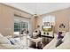 Bright living room showcasing a ceiling fan and sliding glass doors to the outdoor pool at 2008 Water Key Dr, Windermere, FL 34786
