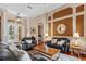 Well-lit Living Room featuring hardwood floors, crown molding, and lots of seating at 2008 Water Key Dr, Windermere, FL 34786