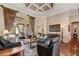 Spacious living room with hardwood floors, tray ceiling, large glass doors to outdoor space at 2008 Water Key Dr, Windermere, FL 34786