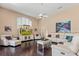 Bright living room featuring high ceilings, a ceiling fan, and a TV at 2008 Water Key Dr, Windermere, FL 34786
