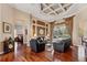 Open living room with hardwood floors, tray ceiling, and access to screened-in pool area at 2008 Water Key Dr, Windermere, FL 34786