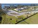 Expansive aerial view showcases a new community with waterfront access, playground, and modern homes at 2189 Weatherly Way, Orlando, FL 32820