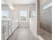 Bathroom with a double vanity, large mirror, and walk-in shower, offering a spa-like feel at 2189 Weatherly Way, Orlando, FL 32820