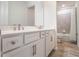 Bright bathroom featuring a double vanity with white cabinetry, quartz countertop, and a shower-tub combo at 2189 Weatherly Way, Orlando, FL 32820