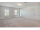 Bright and airy bedroom with plush carpet, neutral walls, and large windows allowing ample natural light at 2189 Weatherly Way, Orlando, FL 32820