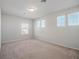 Bedroom with neutral walls, plush carpet and several large windows, perfect for a comfortable living space at 2189 Weatherly Way, Orlando, FL 32820