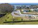 Aerial image of the neighborhood park featuring a playground, lake views, and parking area, all surrounded by greenery at 2189 Weatherly Way, Orlando, FL 32820