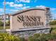 Welcome sign at the neighborhood's entrance with manicured landscaping at 2189 Weatherly Way, Orlando, FL 32820