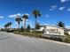 Entrance sign for Sunset Preserve community under a bright blue sky at 2189 Weatherly Way, Orlando, FL 32820