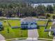 Exterior shot showcasing a well-manicured lawn with a long driveway, and fenced in yard at 2189 Weatherly Way, Orlando, FL 32820