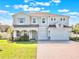 Charming two-story home with a three-car garage and well-manicured front yard at 2189 Weatherly Way, Orlando, FL 32820