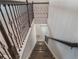 View from the top of staircase highlighting the dark wood stairs and decorative iron railing at 2189 Weatherly Way, Orlando, FL 32820