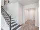 Elegant staircase with dark wood steps and wrought iron railing at 2189 Weatherly Way, Orlando, FL 32820