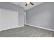 Simple bedroom featuring a closet and a ceiling fan at 2430 Park Ave, Indian Lake Estates, FL 33855