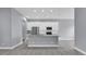 Open kitchen featuring stainless steel appliances, granite countertops, and ample cabinet space at 2430 Park Ave, Indian Lake Estates, FL 33855