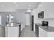 Modern kitchen with granite countertops, stainless steel appliances, and a large island at 2430 Park Ave, Indian Lake Estates, FL 33855