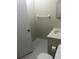Small bathroom with toilet, sink, and towel rack at 2597 Oak Park Way # 205, Orlando, FL 32822