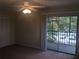 Bedroom featuring a ceiling fan, closet, and sliding glass doors leading to an outdoor balcony at 2597 Oak Park Way # 205, Orlando, FL 32822