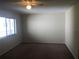 Spacious bedroom featuring neutral walls, plush carpeting, and window with natural light at 2597 Oak Park Way # 205, Orlando, FL 32822