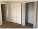 Spacious closet with louvered doors and plenty of storage space at 2597 Oak Park Way # 205, Orlando, FL 32822